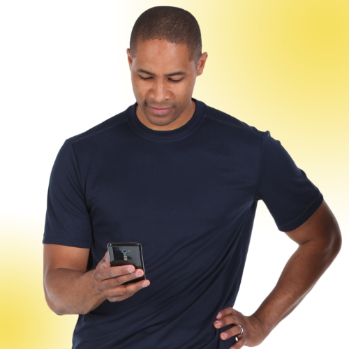 A man sending a message to malesuave on his phone