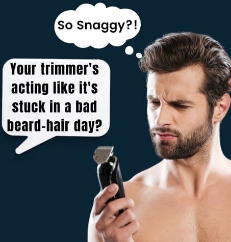 A man examining a beard trimmer, suggesting it may be time to replace