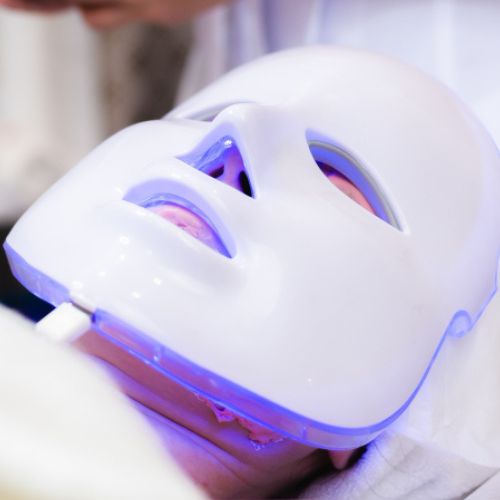 LED Light Therapy Mask On a Client In Aesthetics Salon