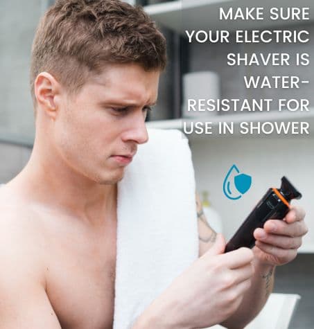 a man getting ready for shower, checking his electric shaver for water resistant symbol