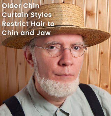 a mature grey-haired man with a well-groomed old style chin curtain beard style. His face is completely smooth