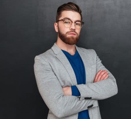 confident man with beard and glasses