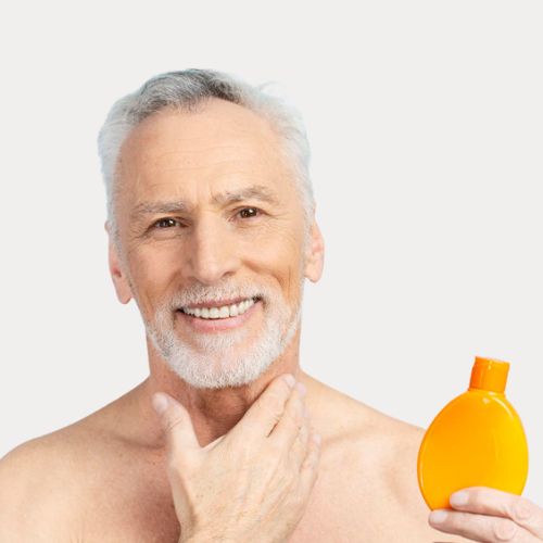 mature guy applying sunscreen after a shower