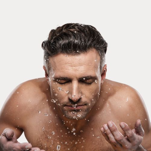 mature guy washing face