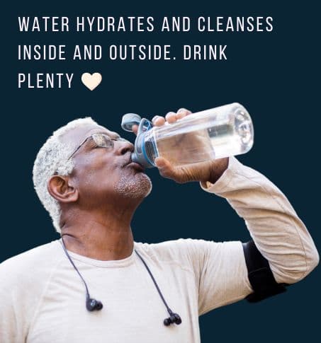 mature man drinking water from a water bottle with a blood pressure monitor on his arm