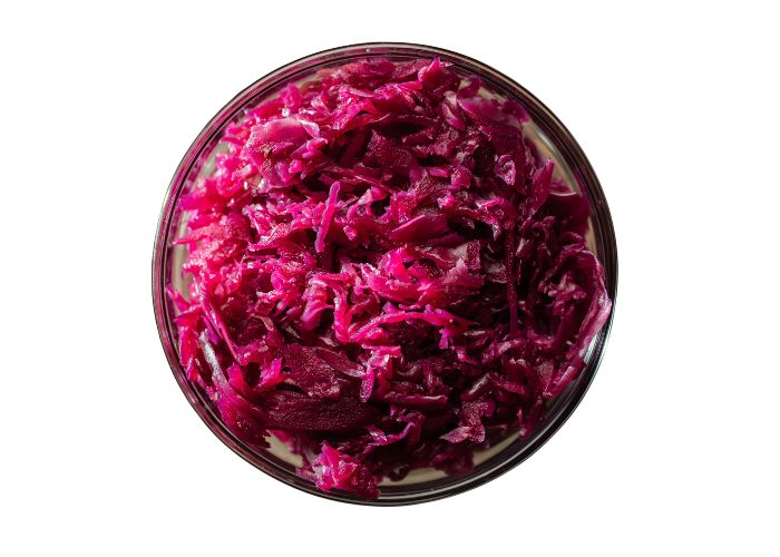 sautéed red cabbage in a bowl against a white background