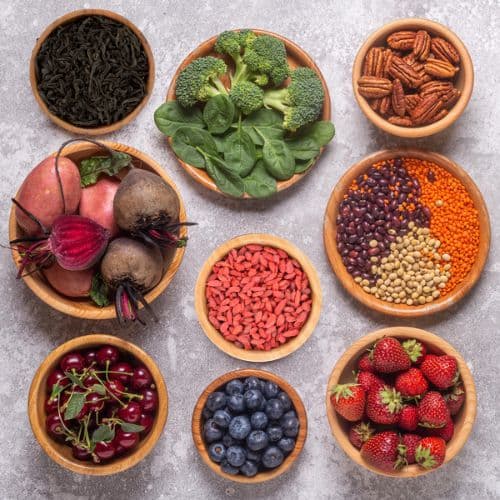 some black tea, spinach, broccoli, blueberries, goji berries, strawberries, beets, purple sweet potato, beans, avocado, spinach, walnuts