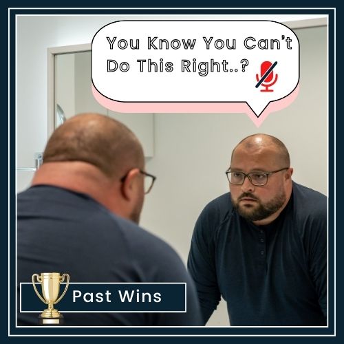 a man facing a mirror on a plain background. Inside the mirror reflection, a small speech bubble says You Can’t Do This, with a faint muted effect to indicate it’s being challenged. Next to the man (on the “real” side), a small trophy labelled Past Wins.
