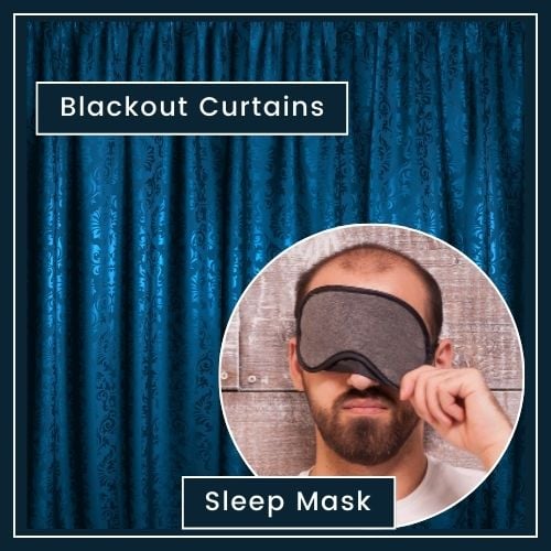 a plain background, with drawn curtains blocking out light. A man in bed wearing a sleep mask Labelled Blackout Curtains and Sleep Mask