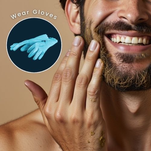 man applying henna dye to his beard without gloves