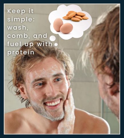 Man washing and combing his beard at a sink with grooming essentials nearby, emphasizing a simple routine and protein boost to support beard growth.