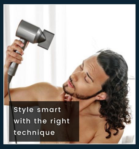 Man using hair dryer with nozzle attachment, holding it at the correct distance while styling