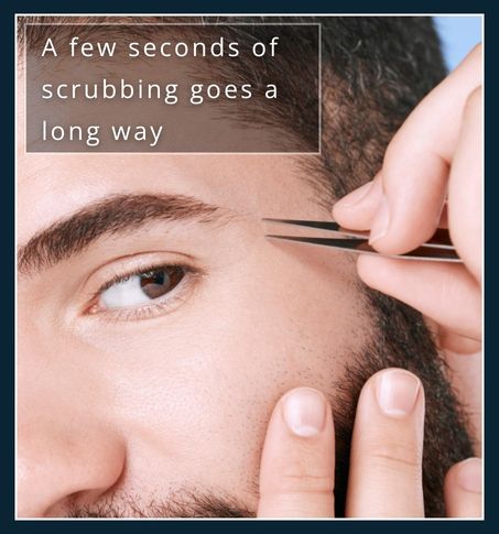 Man using slant-tip tweezers on clean skin after washing face