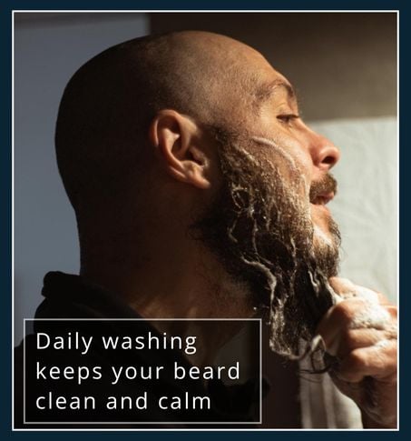 Man washing his beard with water and cleanser to remove dirt and oil buildup