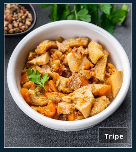 tripe offal dish in a white bowl on the kitchen table