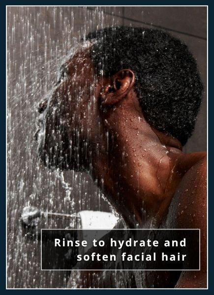man sitting in shower, hydrating his beard with water and steam