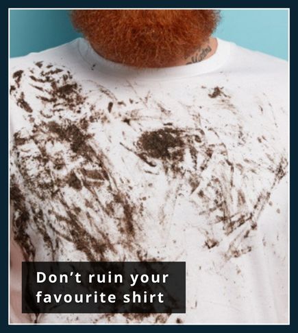 Old white T-shirt with large visible beard dye stain as a reminder not to wear good clothes when dyeing