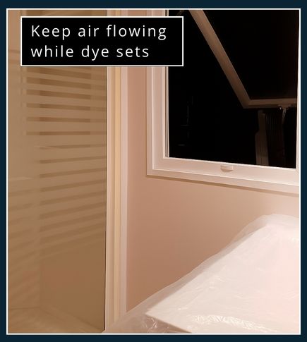 Bathroom window open with fan switched on for airflow during beard dye application