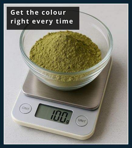 Small kitchen scales measuring out henna powder in a glass bowl for consistent beard dye colour