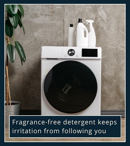 minimal scene of a clean laundry area — a bottle of clear or white detergent beside a washing machine, soft daylight,