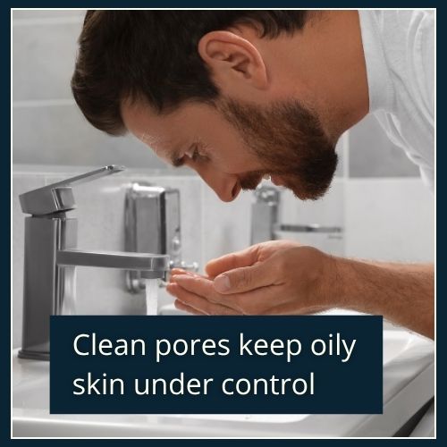 A close-up of a man rinsing his face at a sink - confident, low-effort, and masculine.