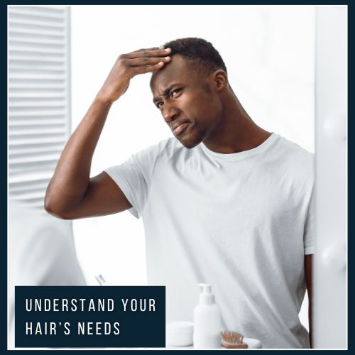 man examing his hair in the mirror