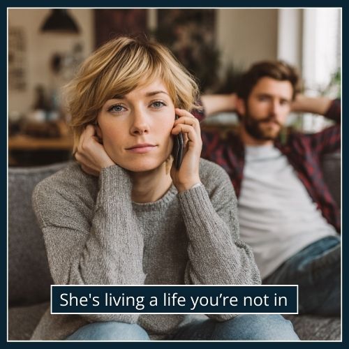 Woman shielding a phone call while sitting beside a man, showing she keeps him hidden.
