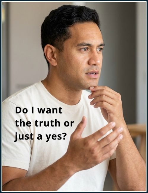 Man pausing mid thought with hand on chin as he reflects before speaking