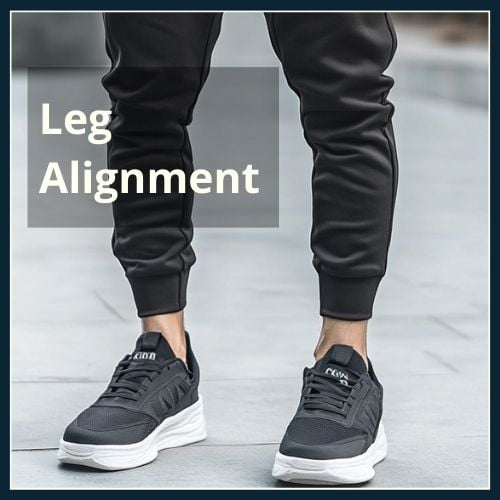 close up of lower legs of man with bow legs wearing joggers