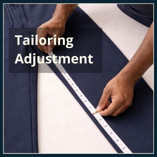 close up of a male athleisure tailor measuring the inseam of a pair of joggers