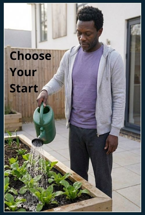 Man watering plants in his small garden, first thing in the morning.
