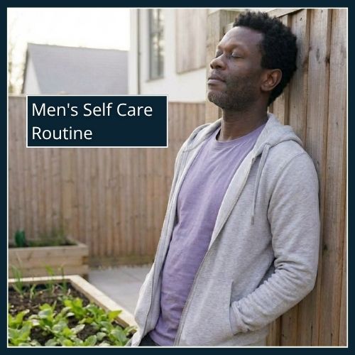 A man leaning back against a wall. He is relaxed, eyes closed with a calm expression on his face. He is taking in the morning light and air.