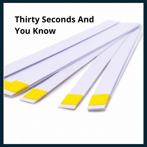 Close up of hard water test strips.
