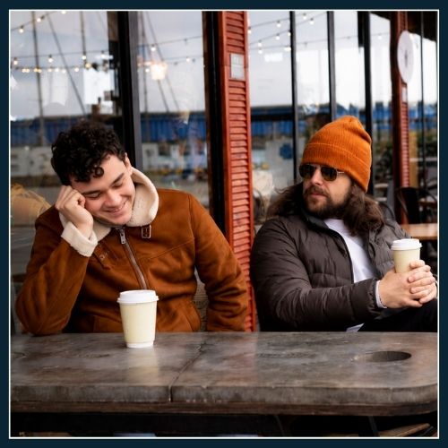 2 Men sitting comfortably and sharing without feeling embarrassed