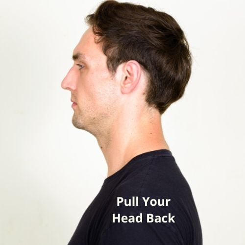 a man standing upright with his head correctly placed above his neck and shoulders. His back is straight and his double chin is reduced because of his improved posture.