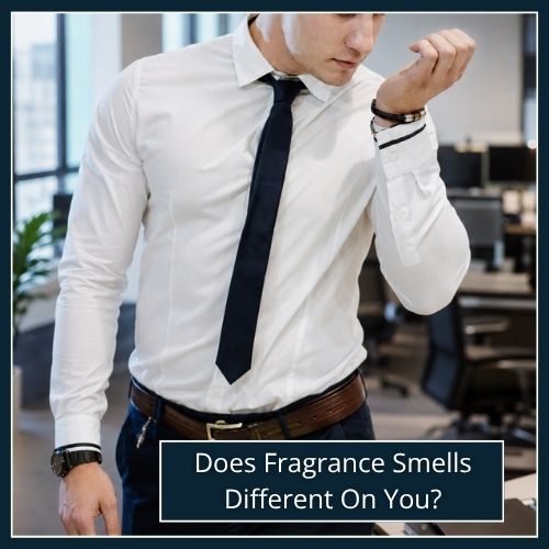 man sniffing cologne on his wrist